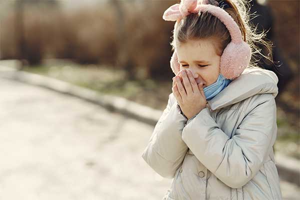 Covering mouth when coughing or sneezing 